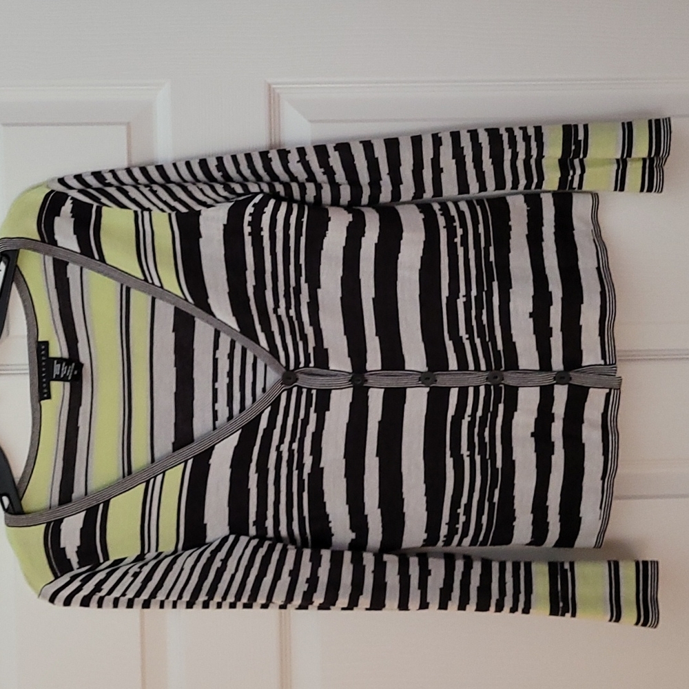 apostrophe cardigan with two sweater tanks.